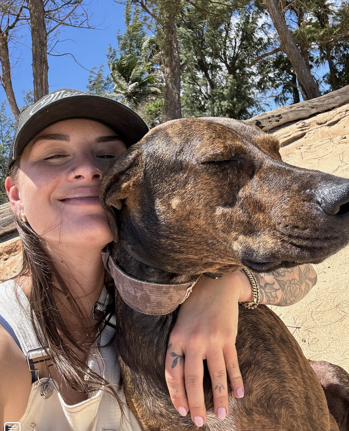 Brett and a dog cheek to cheek
